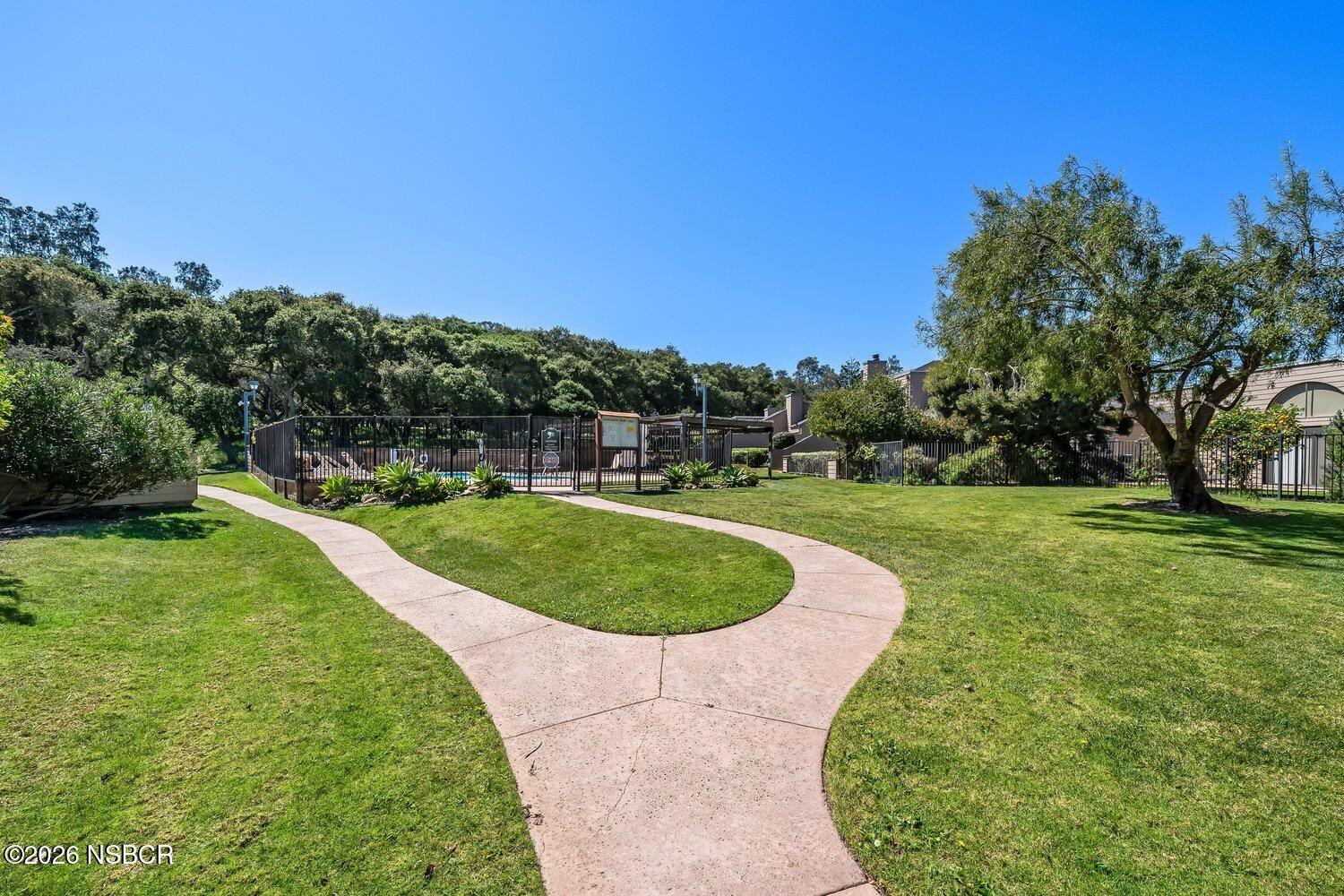 1496 Oakridge Park Road Santa Maria, CA 93455 - Photo 48 of 62 a view of a swimming pool and a yard