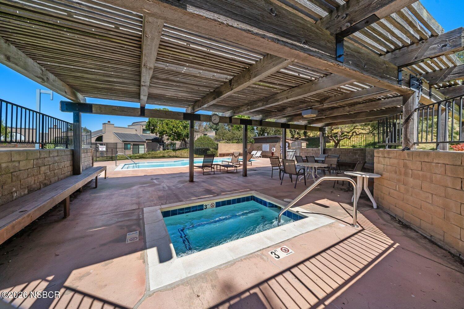 1496 Oakridge Park Road Santa Maria, CA 93455 - Photo 50 of 62 a view of a patio with table and chairs with wooden floor