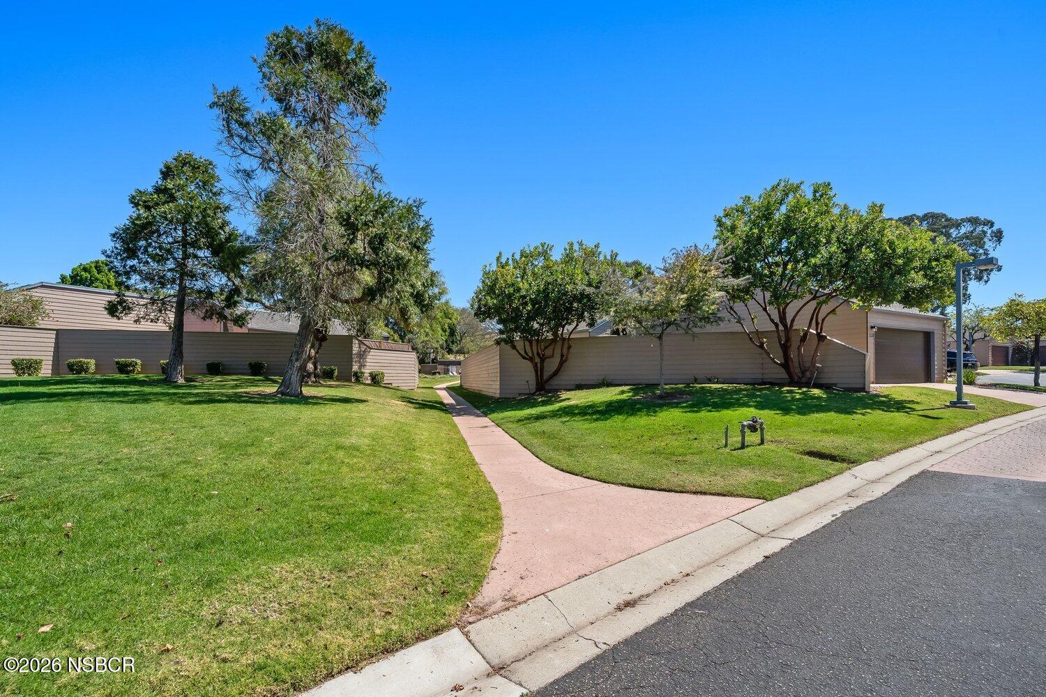 1496 Oakridge Park Road Santa Maria, CA 93455 - Photo 52 of 62 a view of a garden with a house