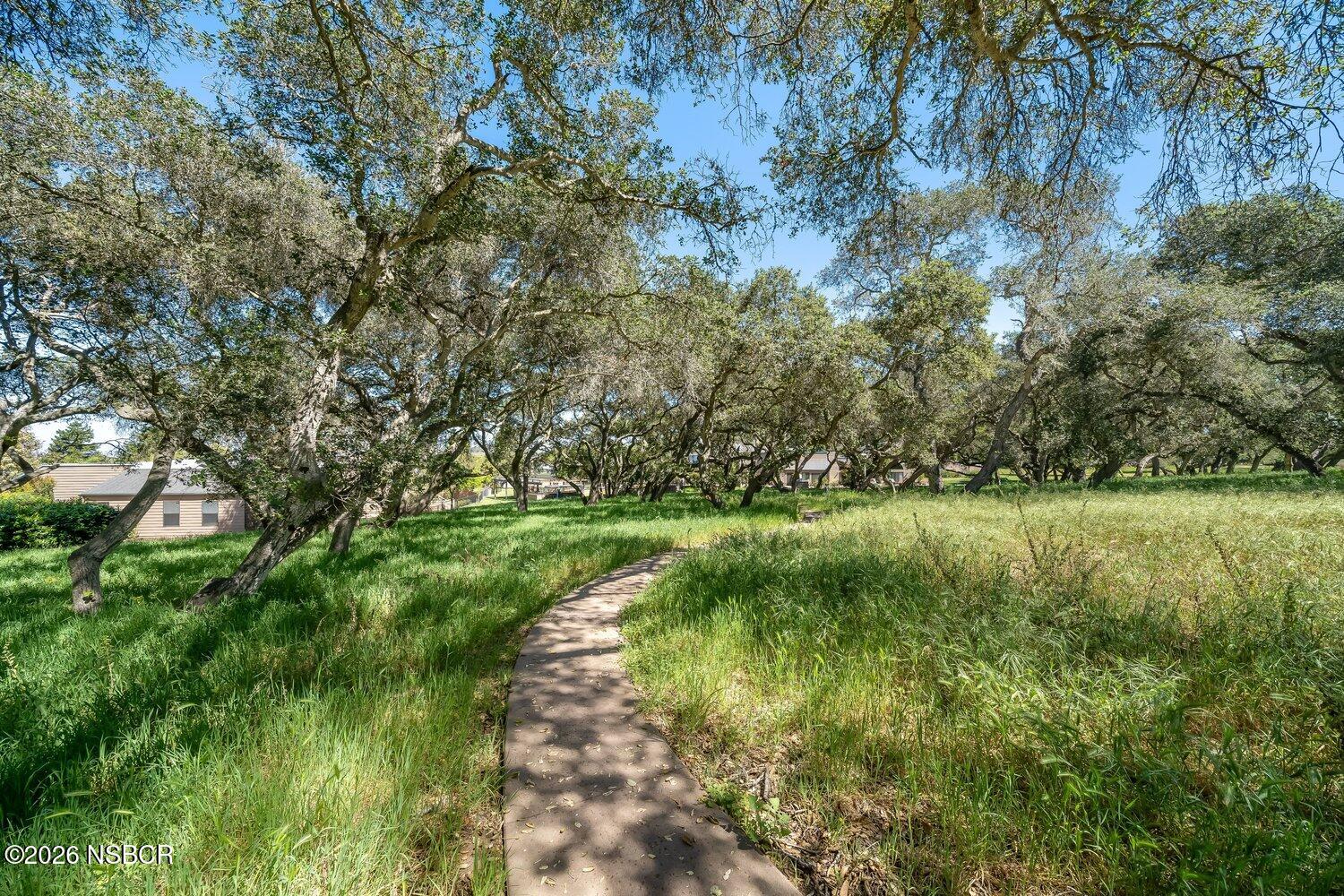 1496 Oakridge Park Road Santa Maria, CA 93455 - Photo 55 of 62 a view of a green field with wooden fence