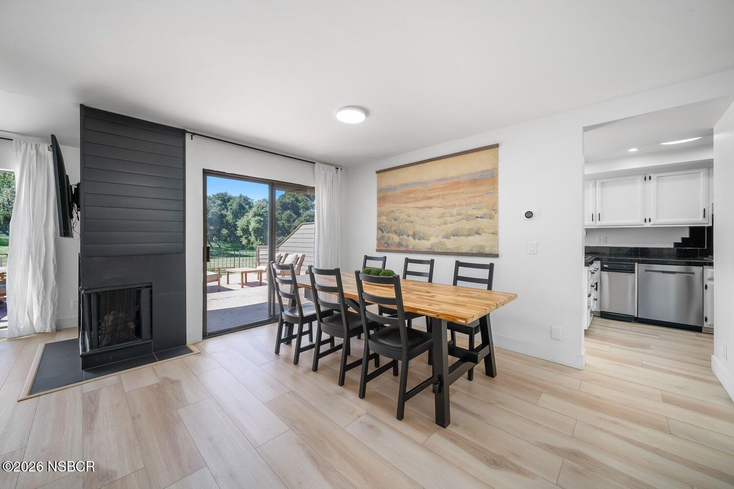 1496 Oakridge Park Road Santa Maria, CA 93455 - Photo 10 of 62 a view of a dining room with furniture window and wooden floor