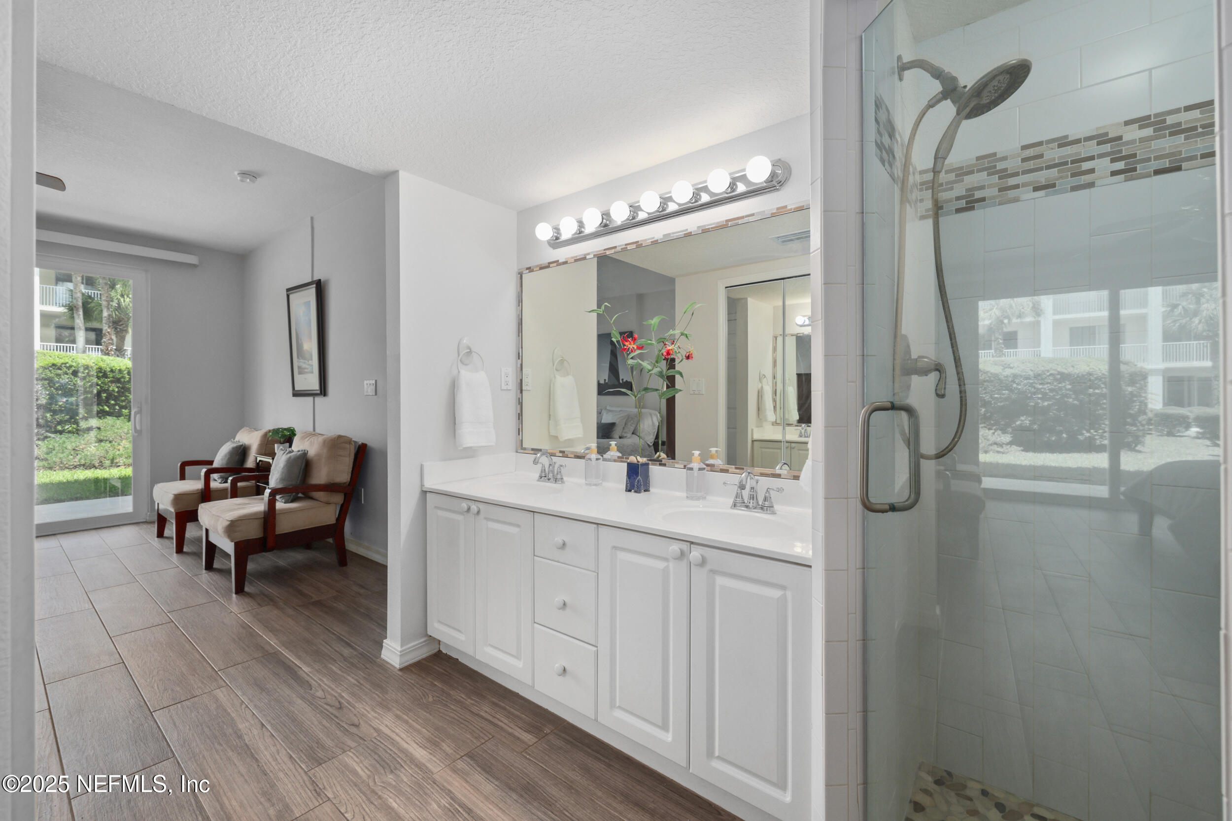 159 Marine Street, Unit 105 St. Augustine, FL 32084 - Photo 24 of 46 a living room with furniture and a chandelier