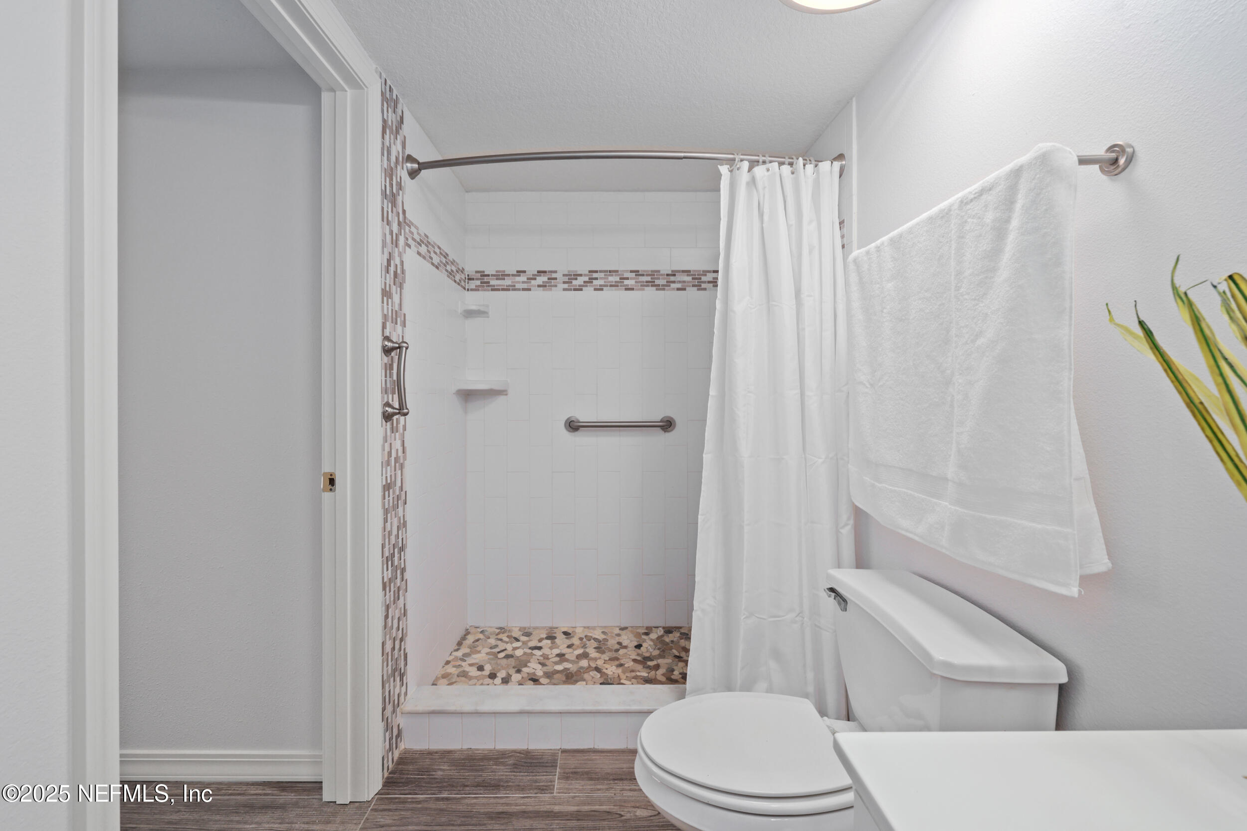 159 Marine Street, Unit 105 St. Augustine, FL 32084 - Photo 29 of 46 a bathroom with a toilet and shower