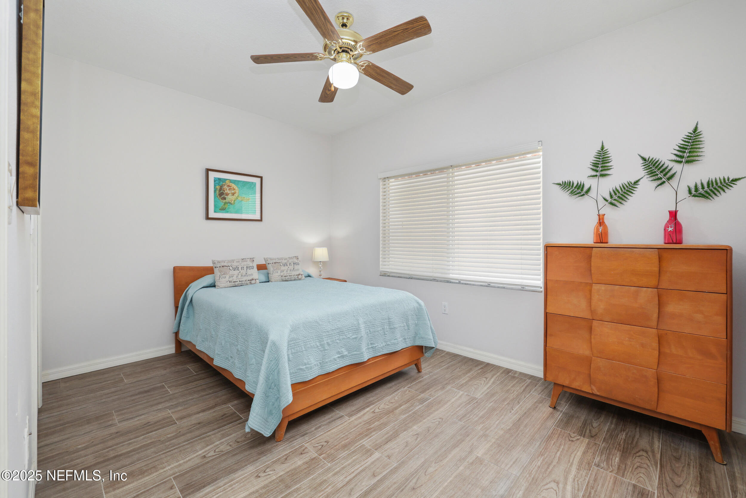 159 Marine Street, Unit 105 St. Augustine, FL 32084 - Photo 30 of 46 a room with a bed and a dresser