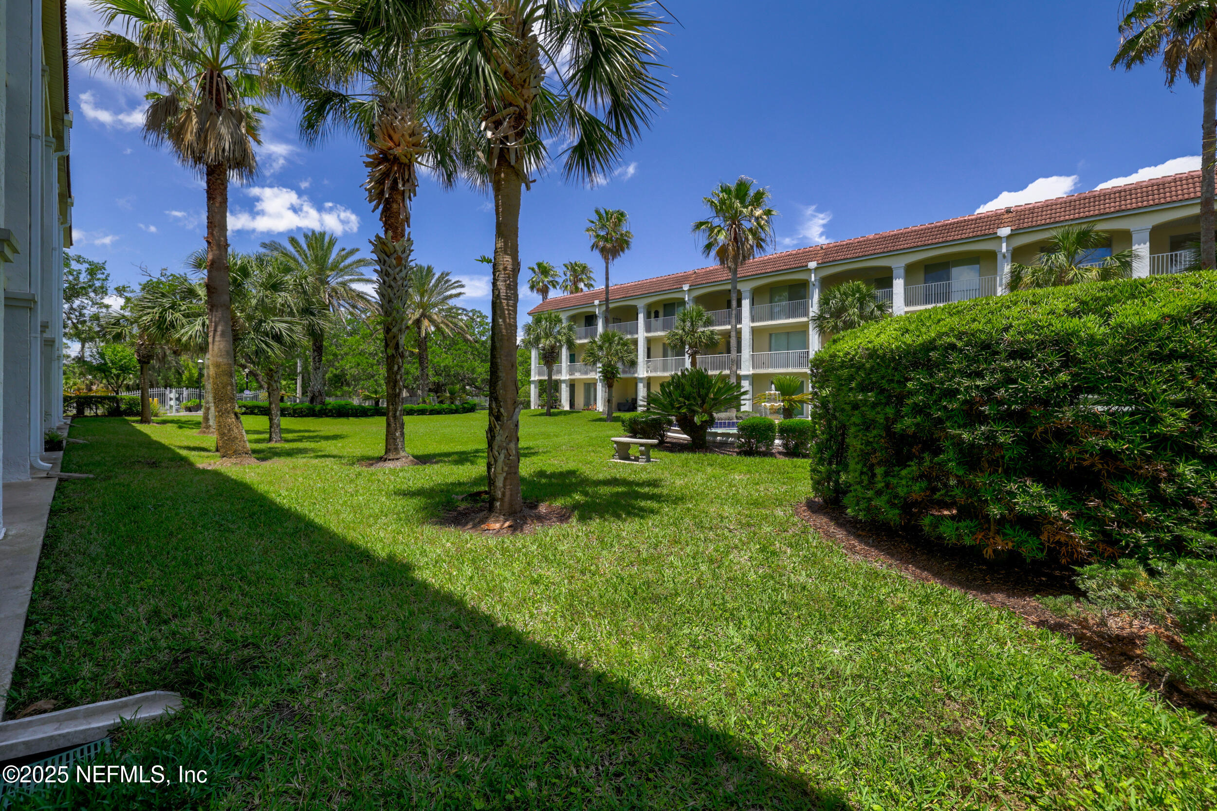 159 Marine Street, Unit 105 St. Augustine, FL 32084 - Photo 38 of 46 a view of a house with a yard and potted plants