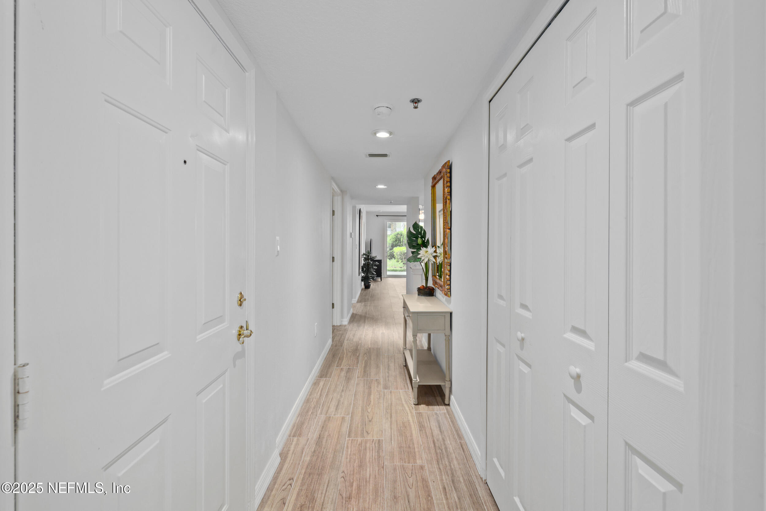 159 Marine Street, Unit 105 St. Augustine, FL 32084 - Photo 7 of 46 a view of a hallway with wooden floor