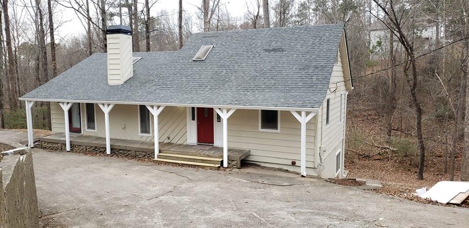 5420 Browns Bridge Road Gainesville, GA 30504 - Photo 1 of 1 a backyard of a house with barbeque oven and wooden fence