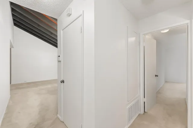 a view of a balcony with wooden floor