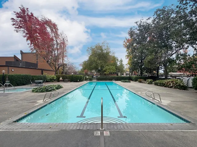 a view of swimming pool with seating space