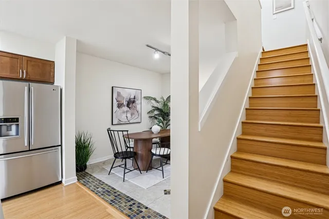 a view of entryway and hall with wooden floor
