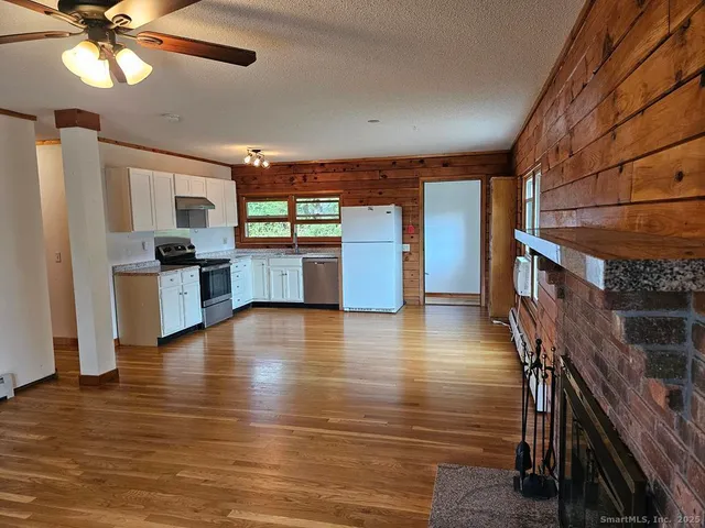 a view of a kitchen with a sink and cabinets