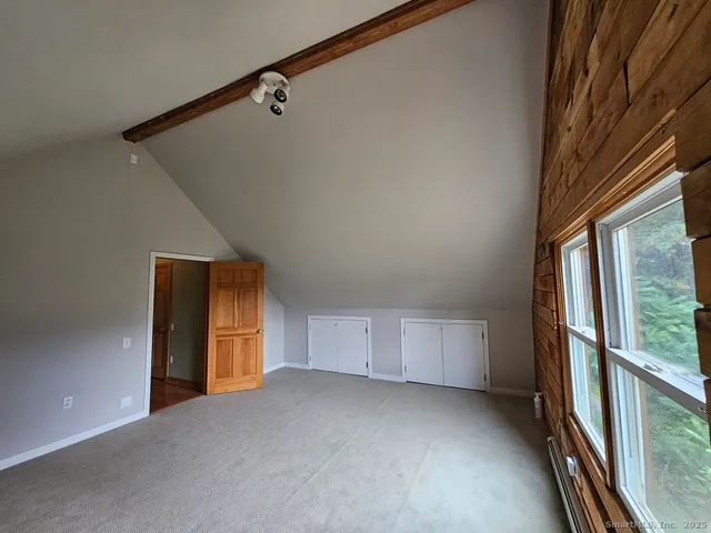 a view of an empty room and a window