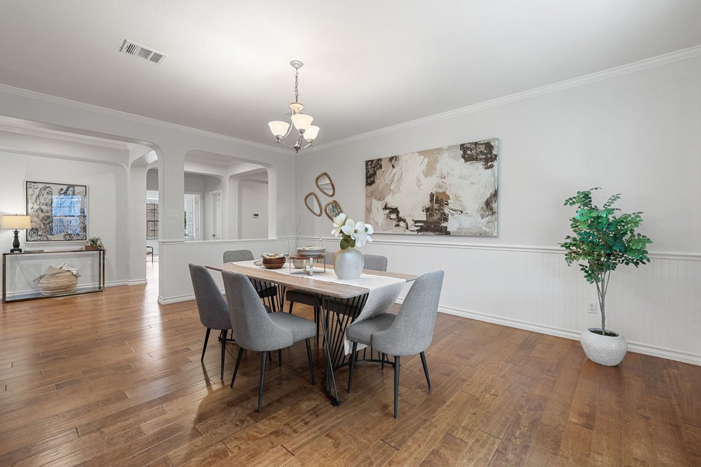 11129 Bastogne Loop Austin, TX 78739 - Photo 16 of 40 Warm wood flooring paired with soft paint colors create such a welcoming atmosphere throughout the home. The balance of warmth and brightness here is especially well done.