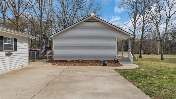 a view of a house with a yard and garage