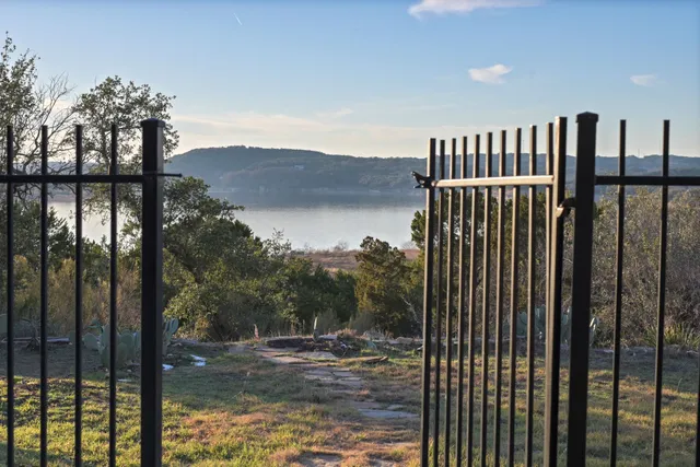a view of a balcony with a lake view