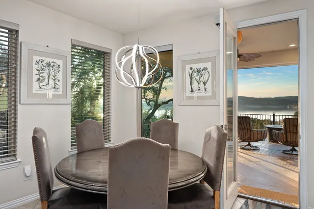 a dining room with furniture and window