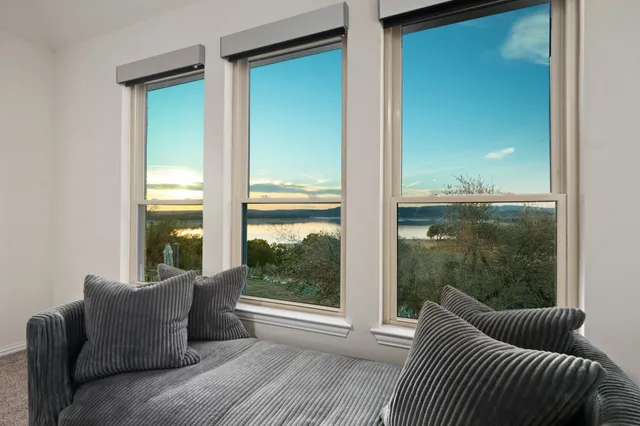 a balcony with furniture and a window