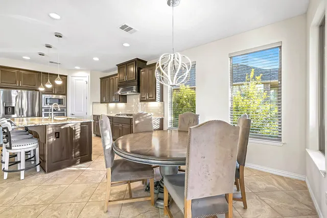 a kitchen with sink stove and cabinets