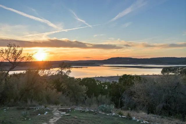 a view of lake with mountain in the background