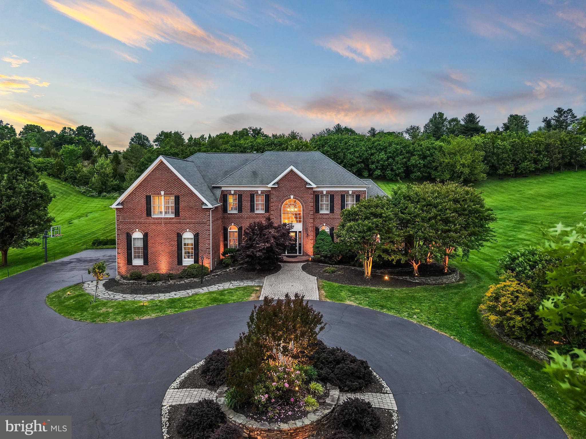 40890 Beechnut Road Leesburg, VA 20175 - Photo 1 of 65 a front view of a house with a yard and garage