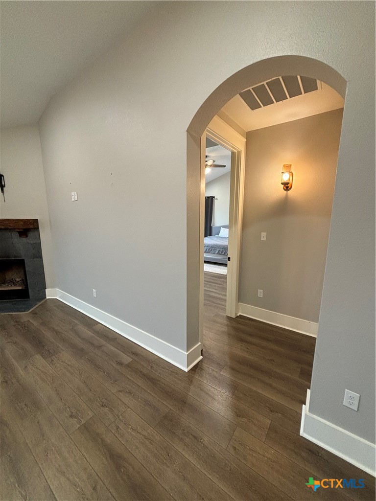 110 Hiram Cook Blanco, TX 78606 - Photo 35 of 46 an empty room with wooden floor and mirror