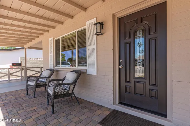 an outdoor view of house with outdoor seating space
