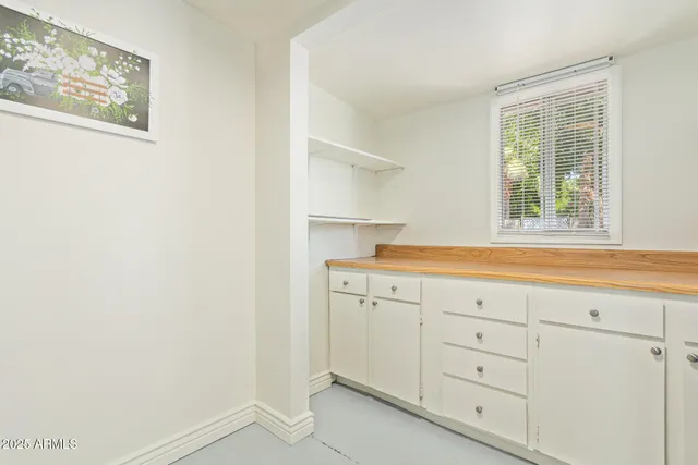 a view of cabinets and window