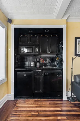 a kitchen with a sink and cabinets