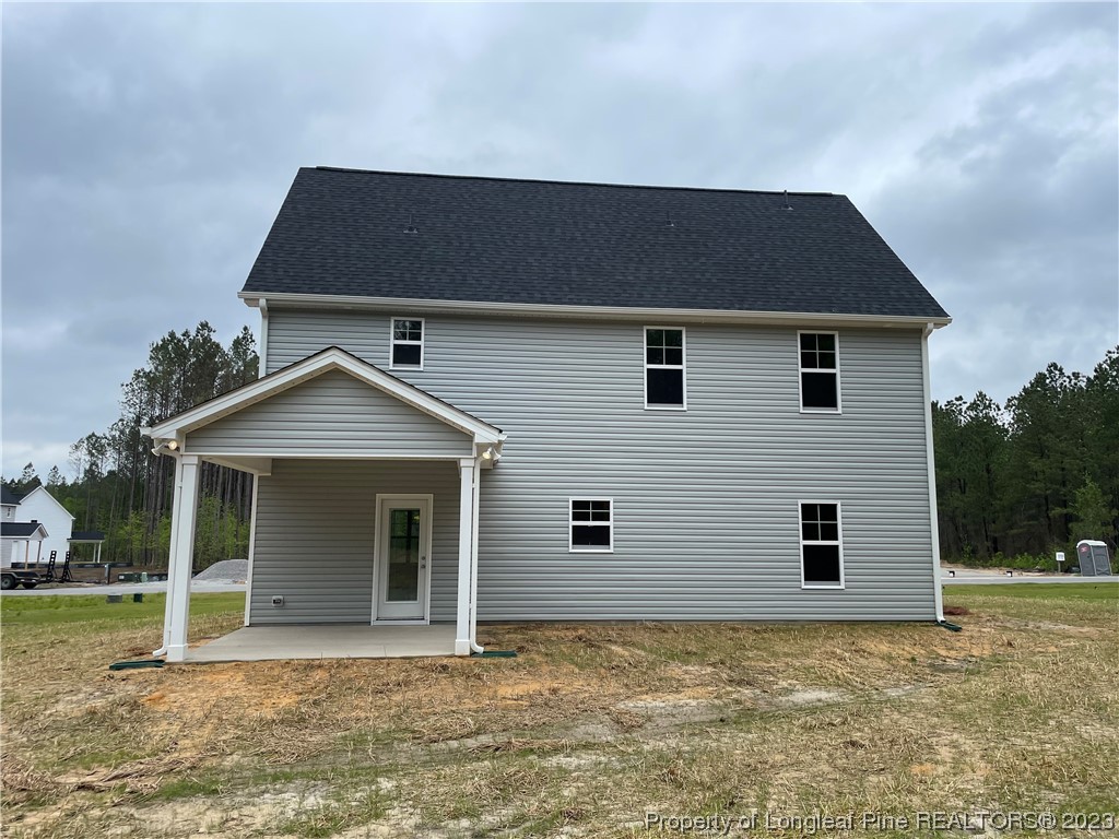 184 Solomon Drive Cameron, NC 28326 - Photo 11 of 13 a front view of a house with a yard