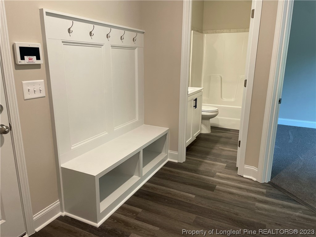 184 Solomon Drive Cameron, NC 28326 - Photo 2 of 13 a view of a hallway with wooden floor and staircase