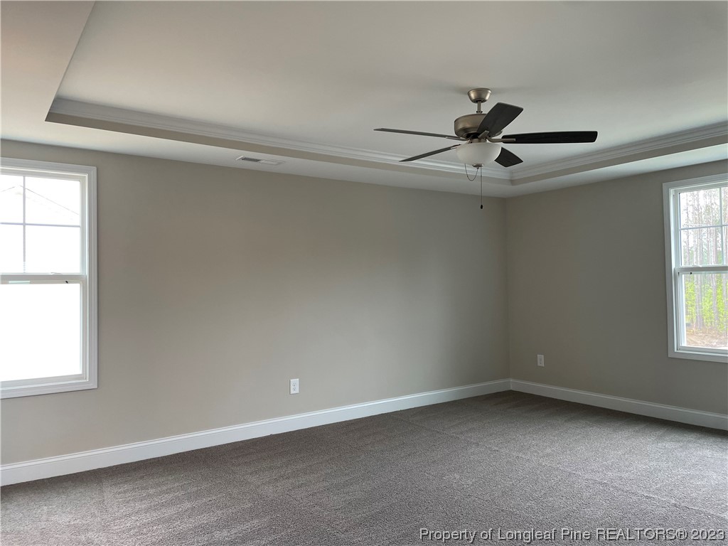 184 Solomon Drive Cameron, NC 28326 - Photo 7 of 13 an empty room with a window and a fan