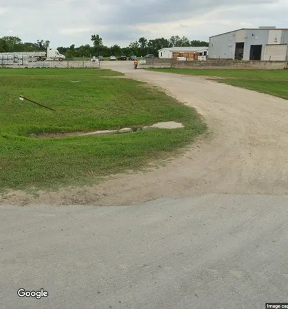 a view of a large yard with lots of green space