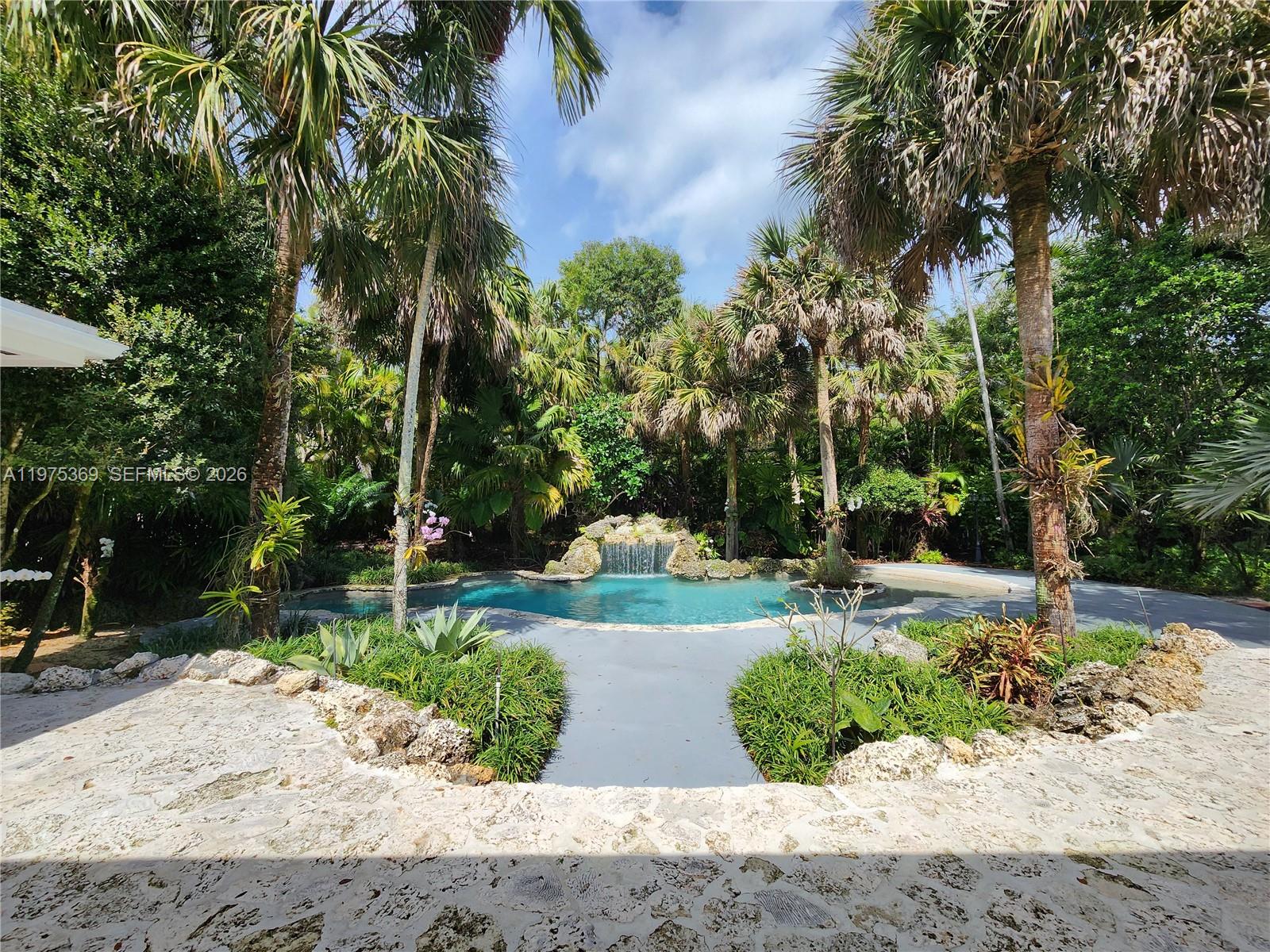 6065 Southwest 133rd Street Pinecrest, FL 33156 - Photo 22 of 41 a view of a park with plants and trees
