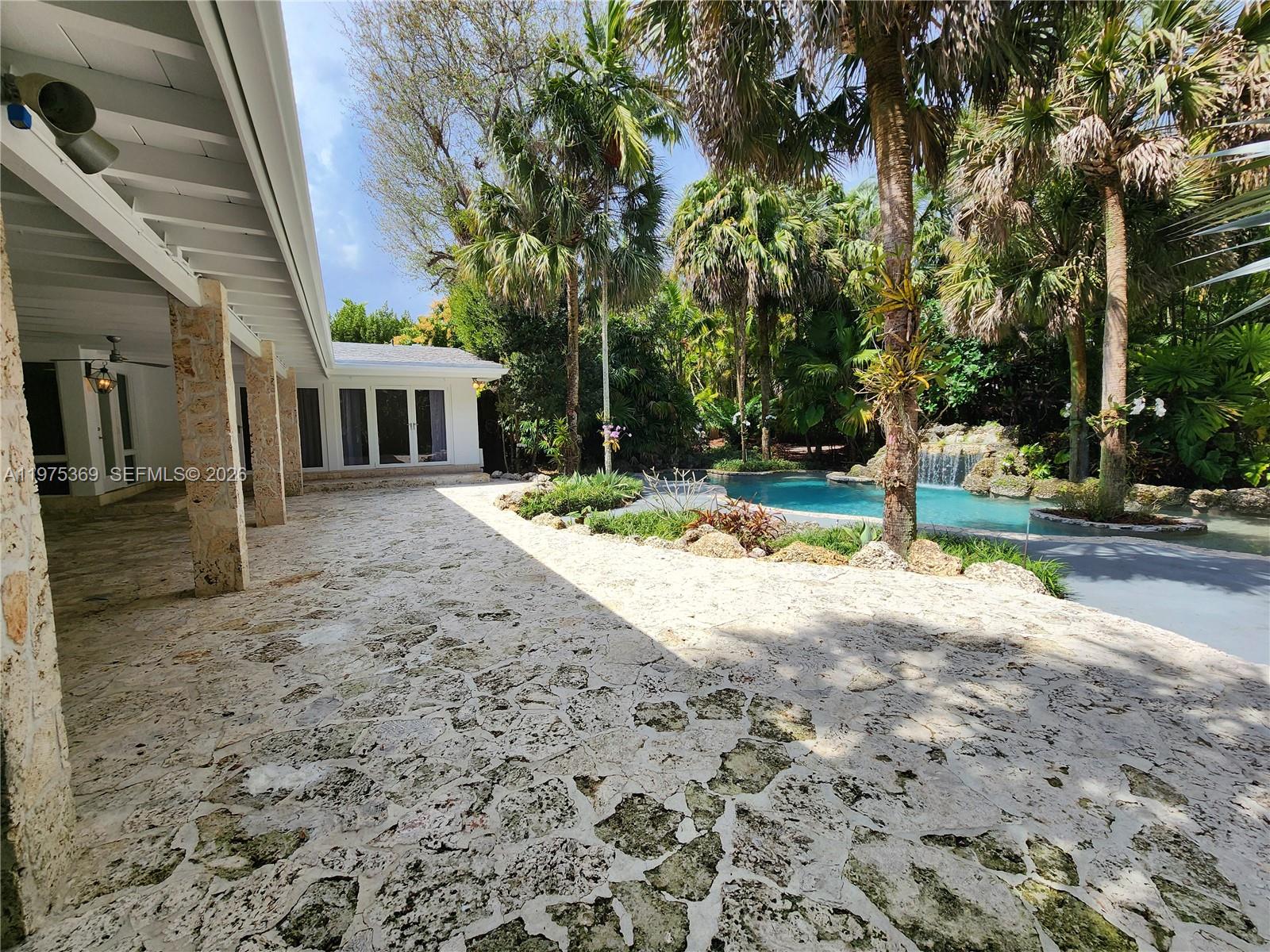 6065 Southwest 133rd Street Pinecrest, FL 33156 - Photo 26 of 41 a view of outdoor space yard and porch
