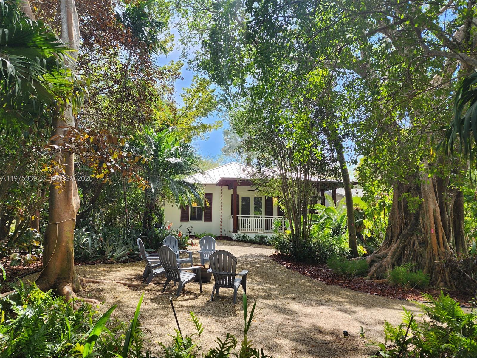6065 Southwest 133rd Street Pinecrest, FL 33156 - Photo 29 of 41 a view of patio in the backyard