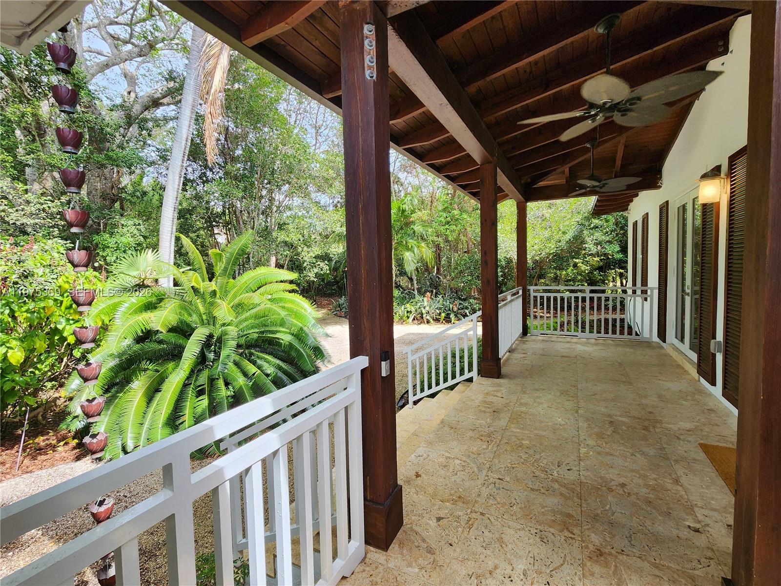 6065 Southwest 133rd Street Pinecrest, FL 33156 - Photo 34 of 41 a view of a porch