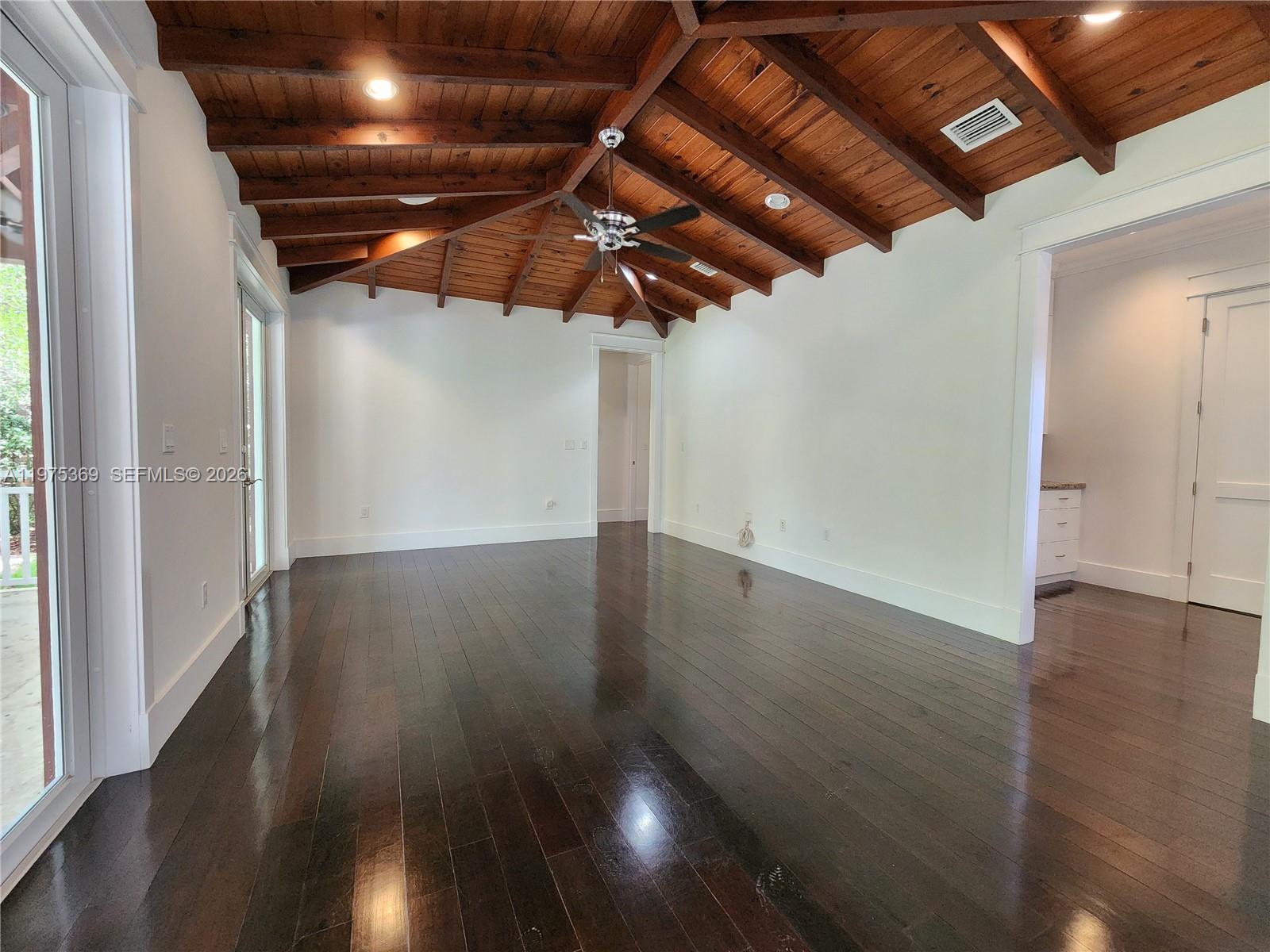 6065 Southwest 133rd Street Pinecrest, FL 33156 - Photo 36 of 41 a view of an empty room with wooden floor