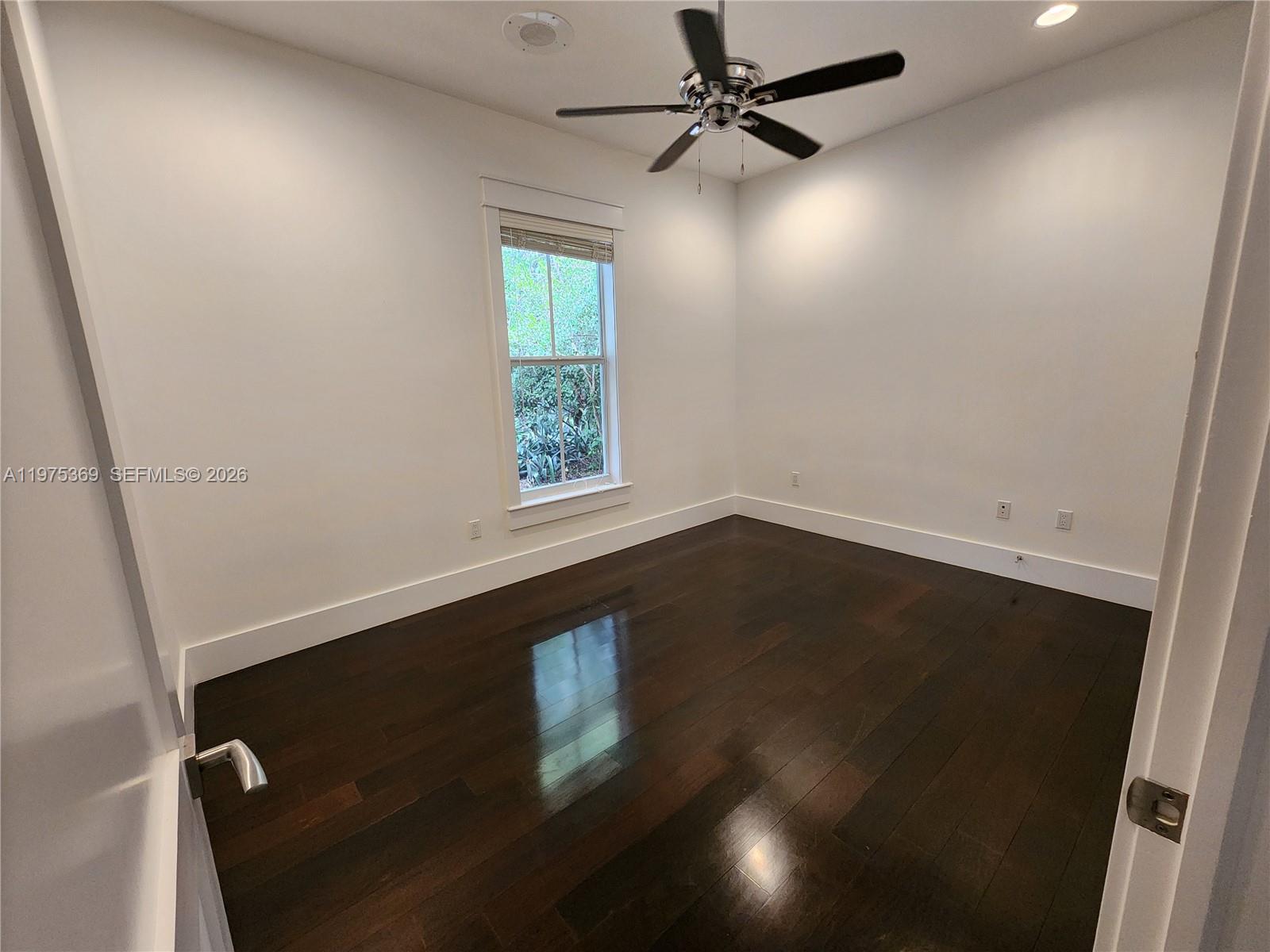 6065 Southwest 133rd Street Pinecrest, FL 33156 - Photo 41 of 41 an empty room with a window