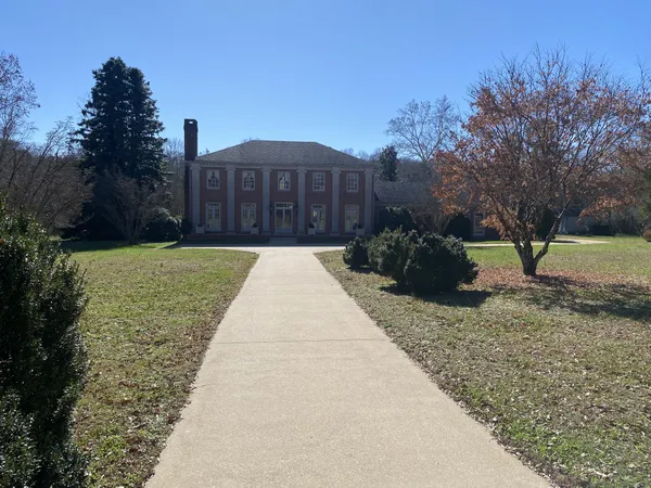 a view of a livingroom with furniture and hardwood floor