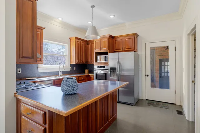 a front view of a house with garden