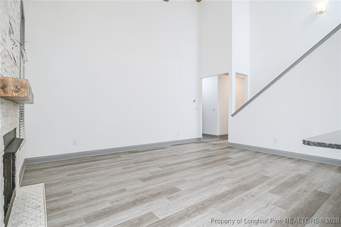 808 Mumford Road Raeford, NC 28376 - Photo 15 of 50 a view of an empty room with wooden floor and stairs