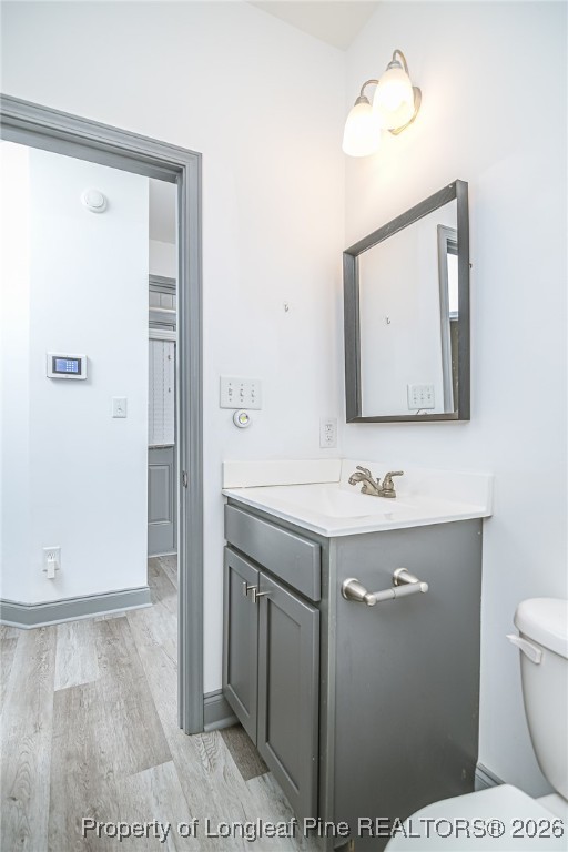808 Mumford Road Raeford, NC 28376 - Photo 24 of 50 a bathroom with a sink a toilet and mirror