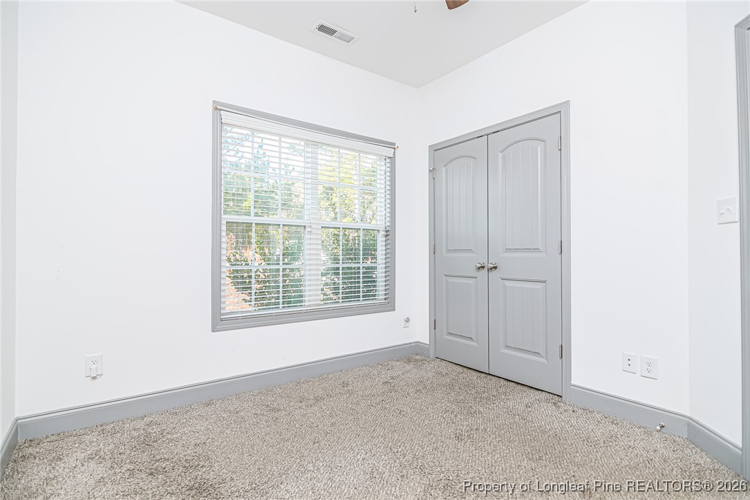 808 Mumford Road Raeford, NC 28376 - Photo 27 of 50 a view of an empty room with a window