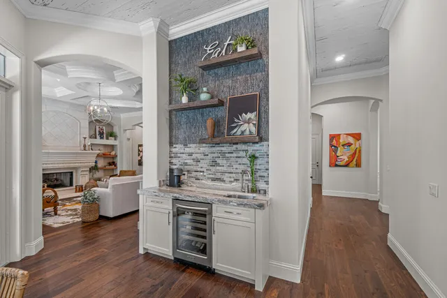 a hallway with fireplace and wooden floor