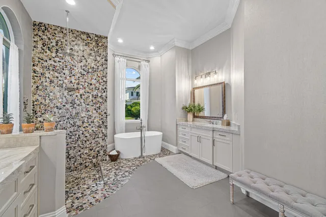 a bathroom with a double vanity sink toilet and shower