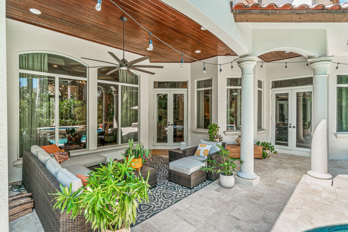 2280 Queen Palm Road Boca Raton, FL 33432 - Photo 4 of 21 a building outdoor space with patio furniture and potted plants