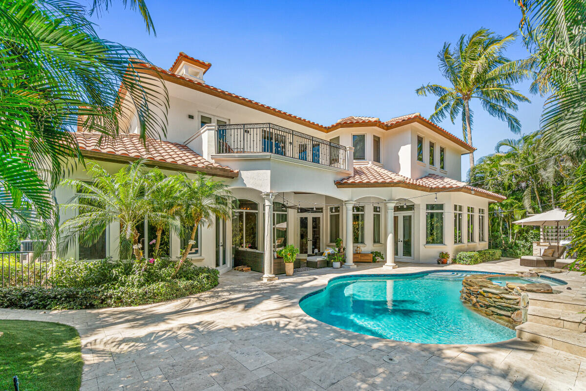 2280 Queen Palm Road Boca Raton, FL 33432 - Photo 5 of 21 a front view of a house with a yard and potted plants
