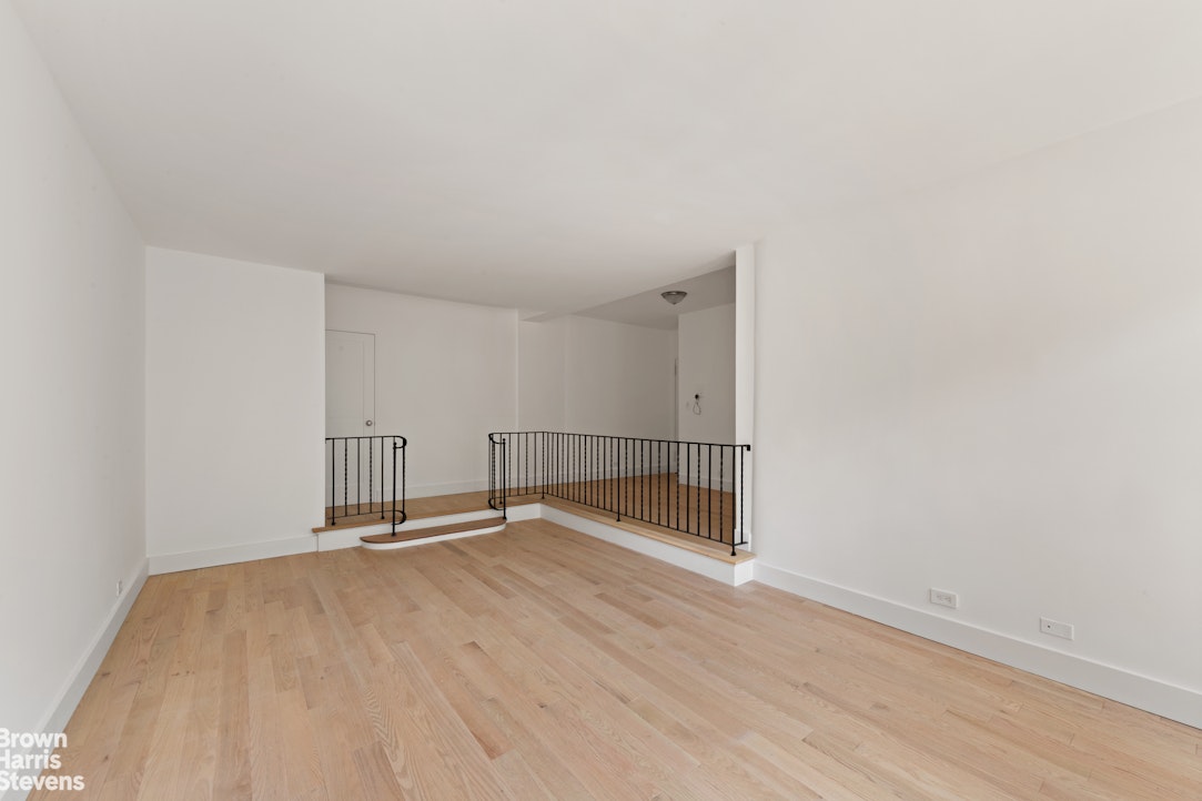 98-41 64th Road, Unit 3G Queens, NY 11374 - Photo 10 of 14 a view of empty room with wooden floor