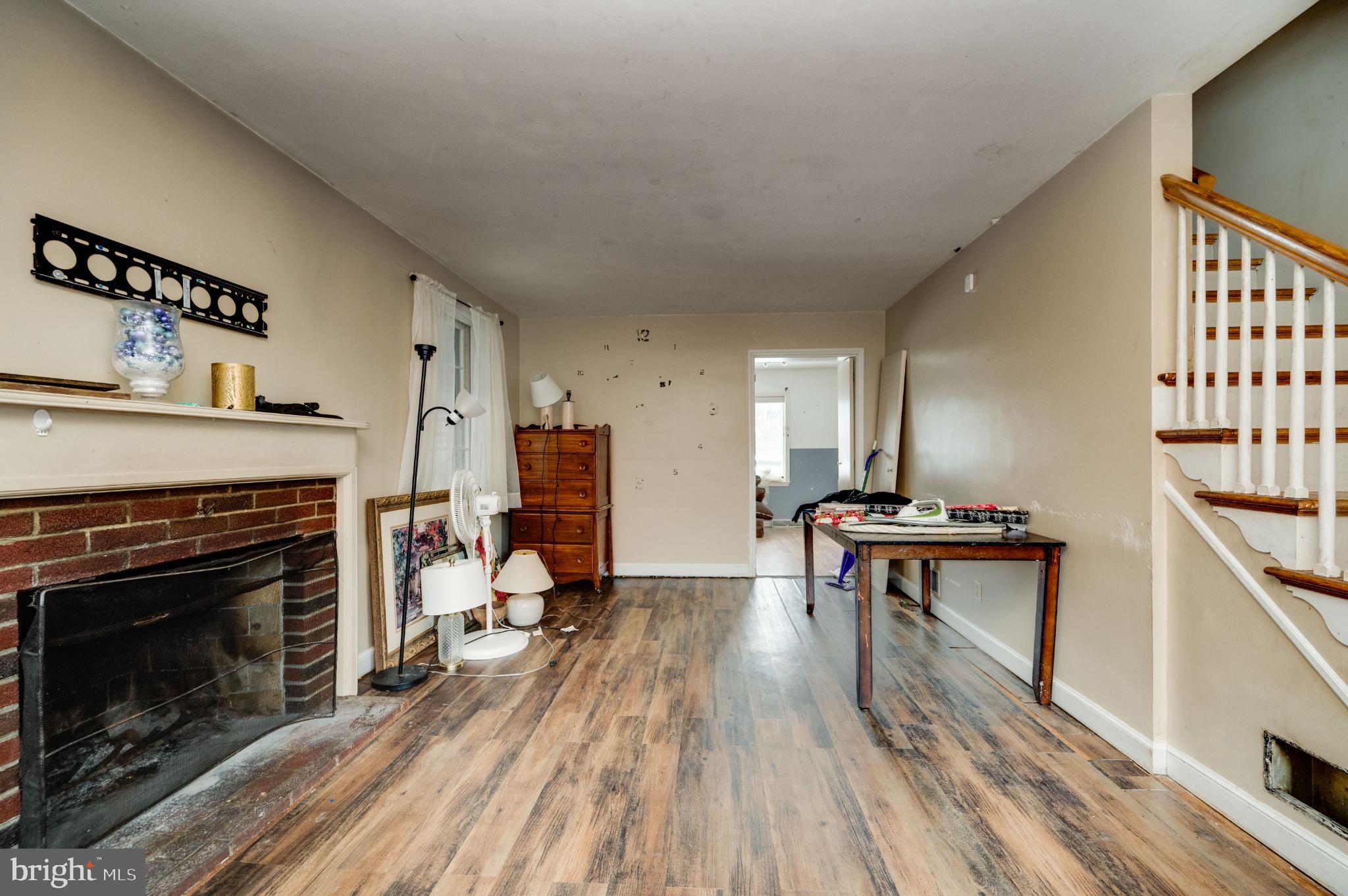 9 West 35th Street Reading, PA 19606 - Photo 15 of 52 a living room with furniture a fireplace and a flat screen tv