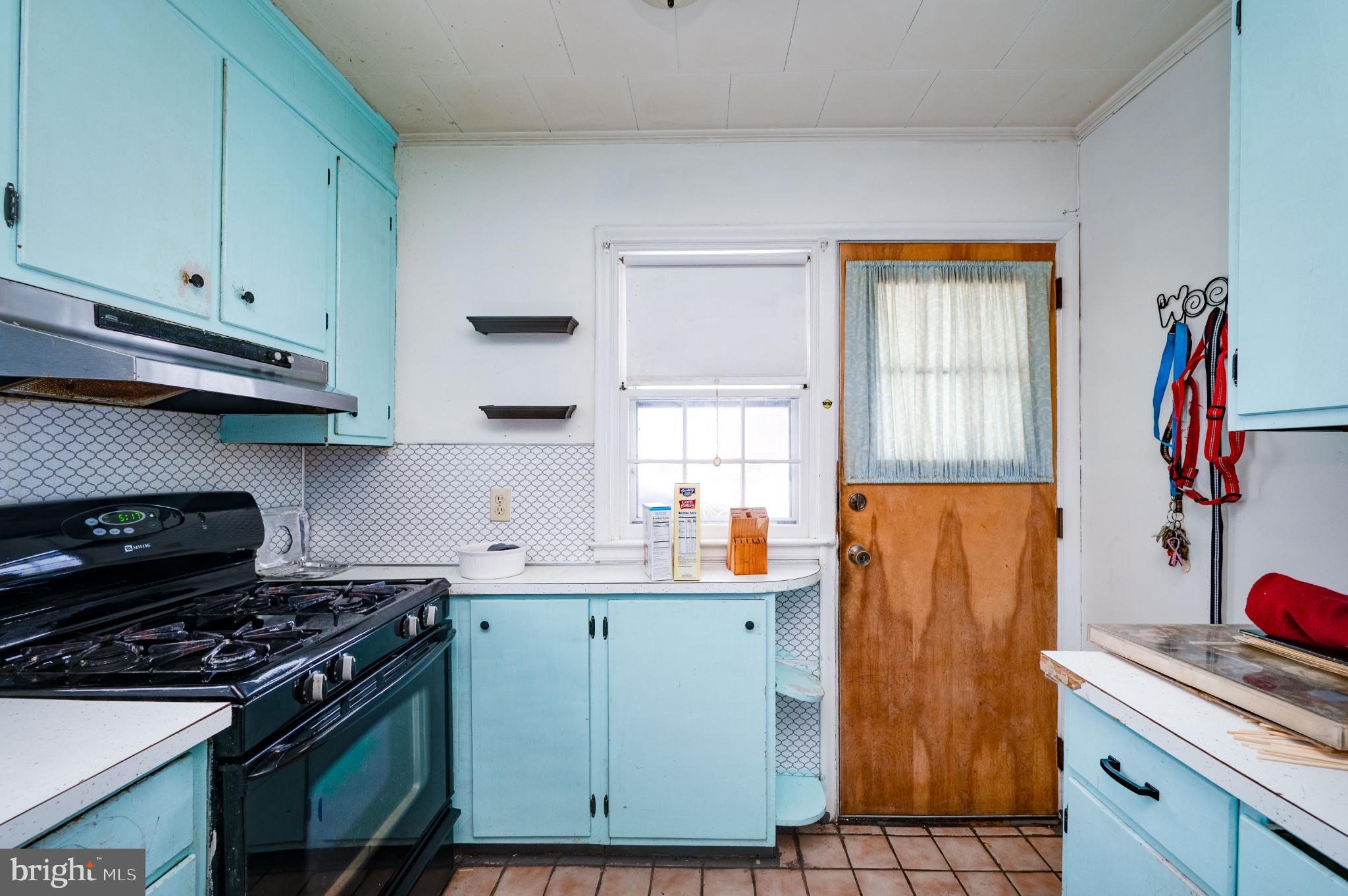 9 West 35th Street Reading, PA 19606 - Photo 23 of 52 a kitchen with stainless steel appliances granite countertop a stove and a sink
